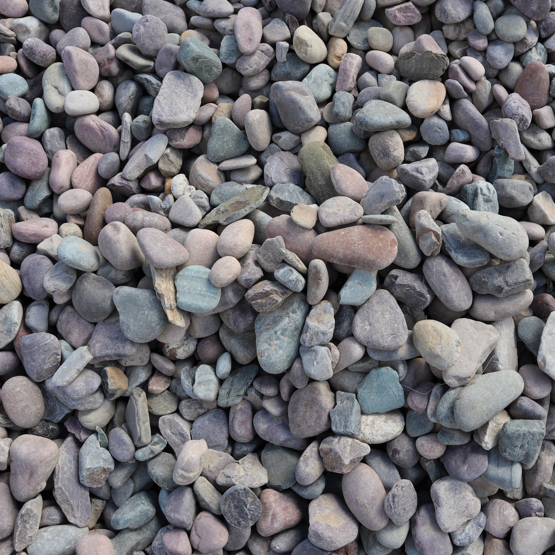 1.5 inch round river rock landscape material overhead view.