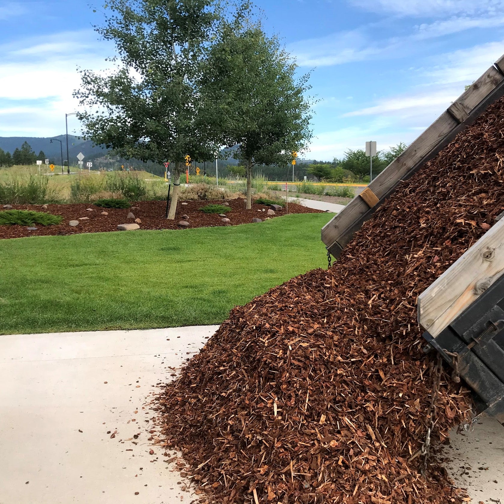 Shredded Fir Bark being dumped from dump truck in the south hills of Missoula.