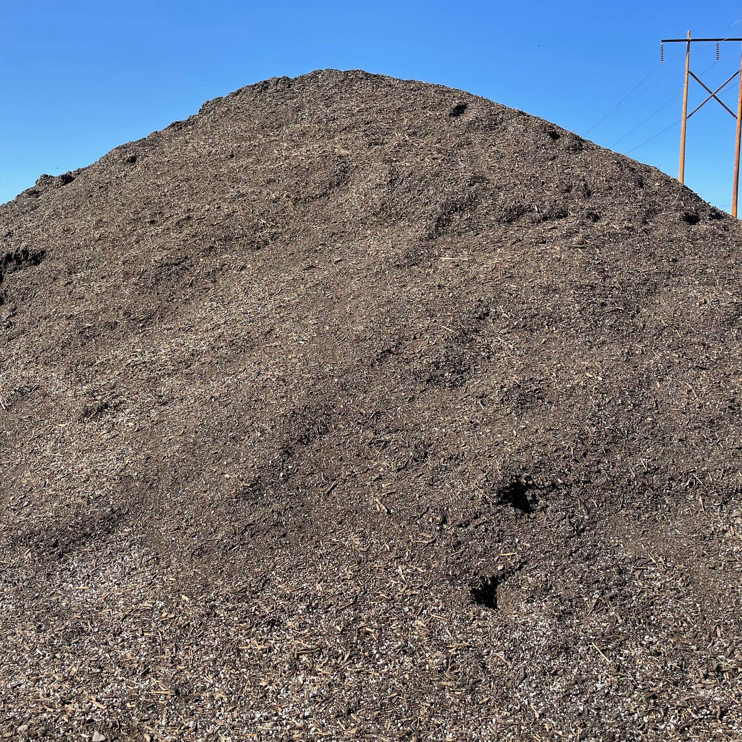 A big pile of Garden City Premium Potting Soil.