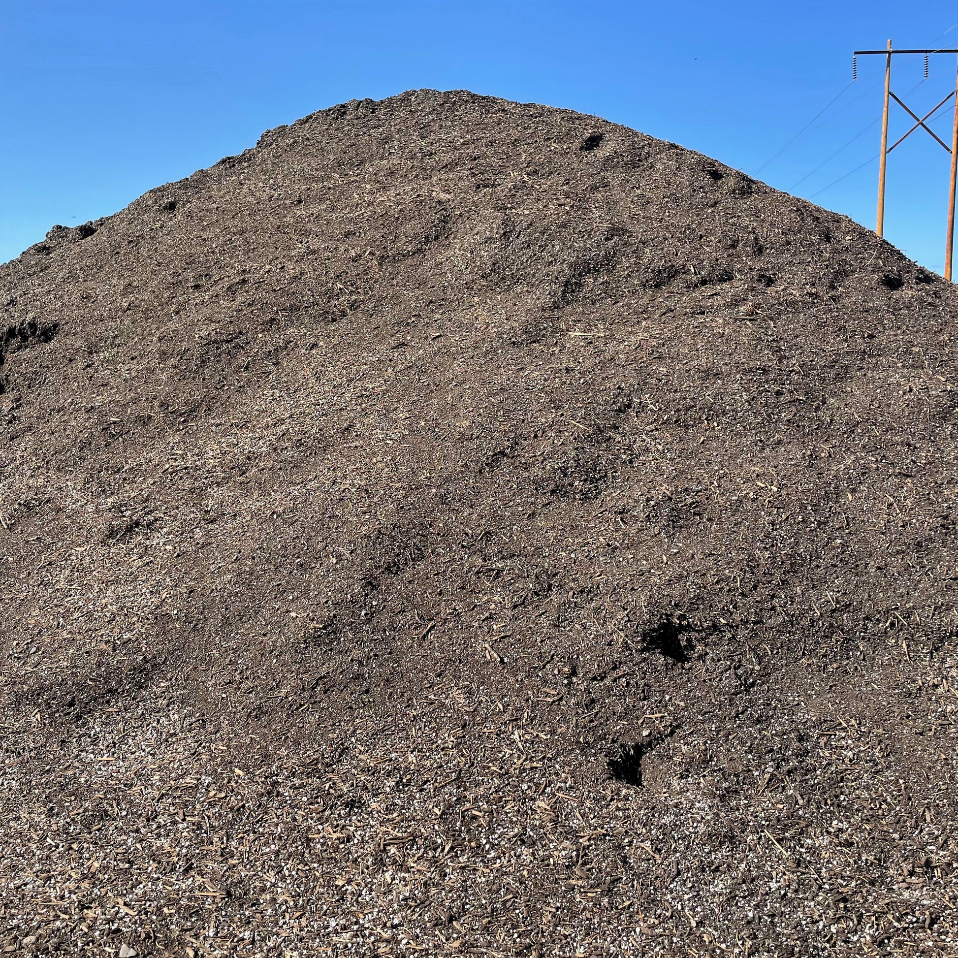 A big pile of Garden City Premium Potting Soil.