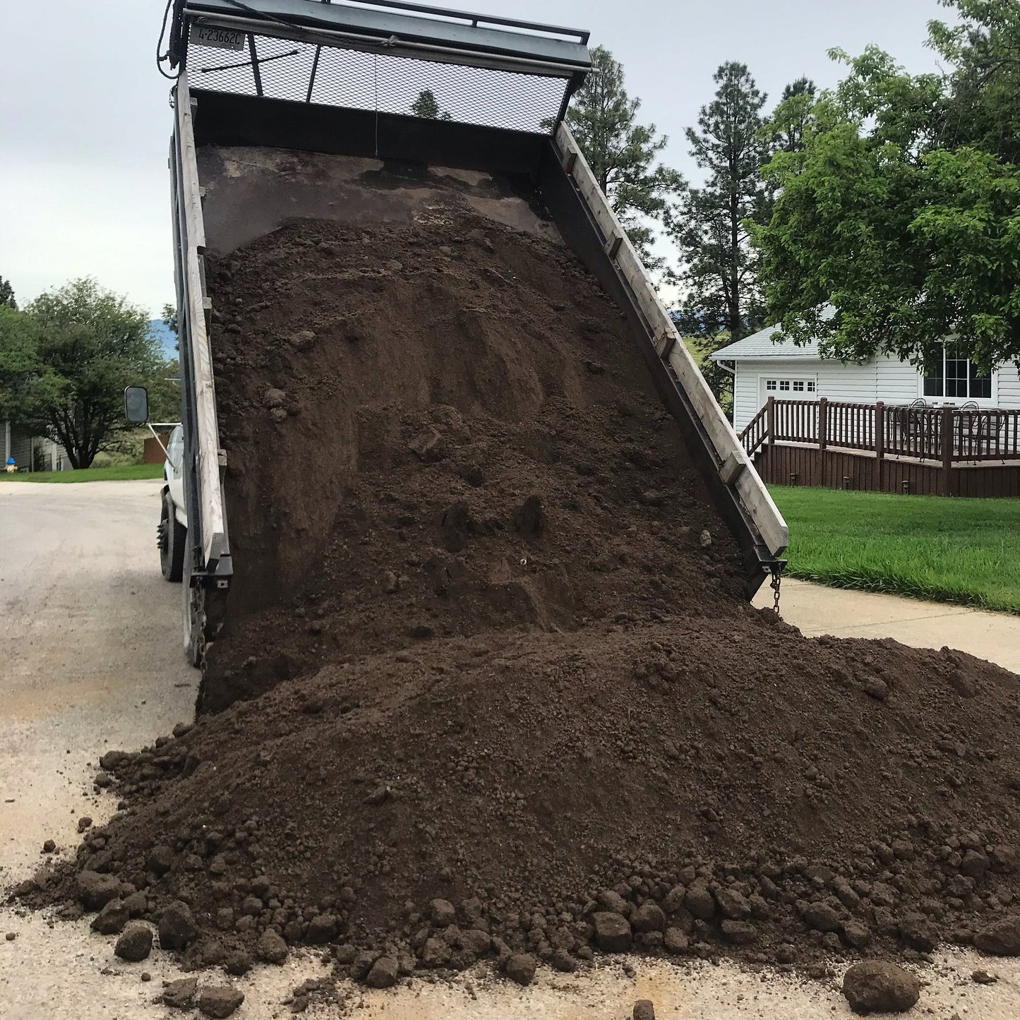 Big dump of Screened Topsoil from dump truck in Missoula.